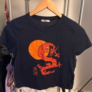 Dark blue shirt with Chinese dragon and word “hero” in simplified Chinese.